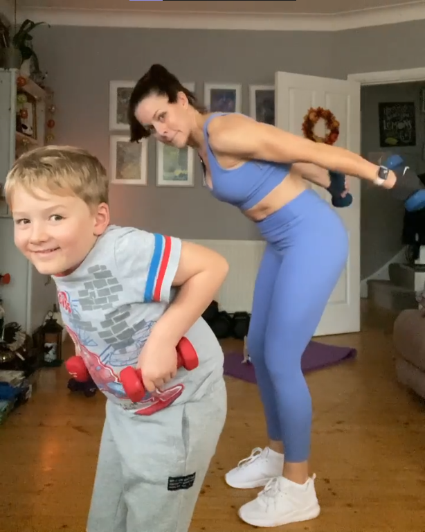 Emma rumble working out with son
